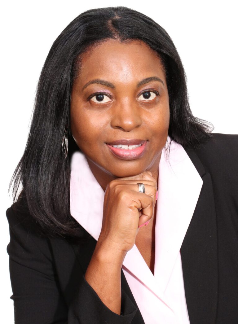 A woman in a black jacket and white shirt