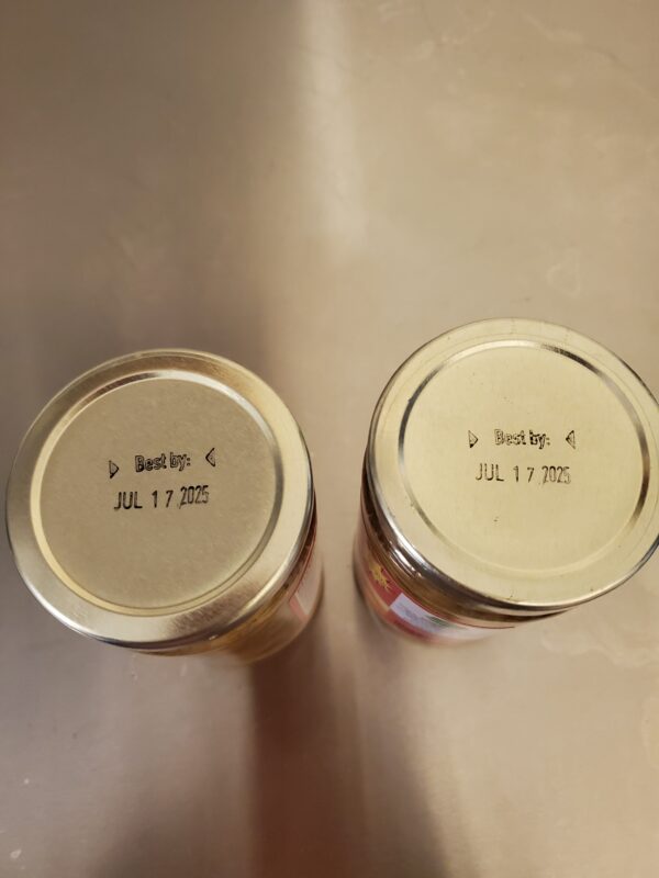 Two jars with the expiration date of a product.