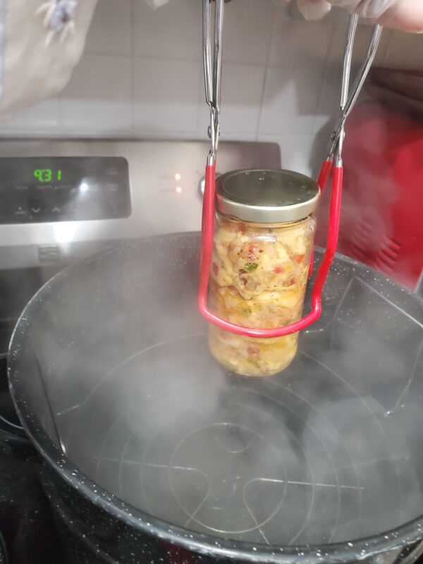 A jar of food is being cooked in the oven.