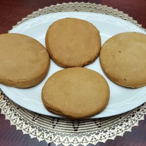 A plate of cookies on top of a table.